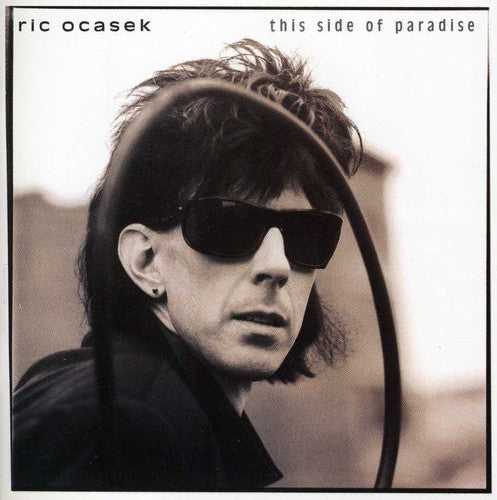 the album cover for Ric Ocasek - This Side of Paradise