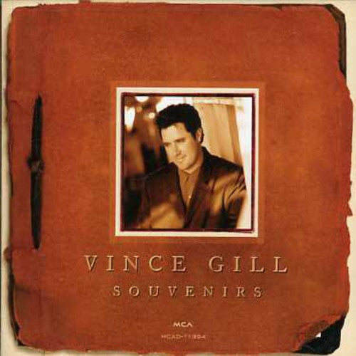 the album cover for Vince Gill - Souvenirs: Greatest Hits