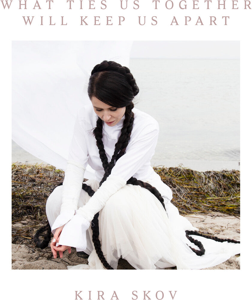 the album cover for Kira Skov - What Ties Us Together, Will Keep Us Apart