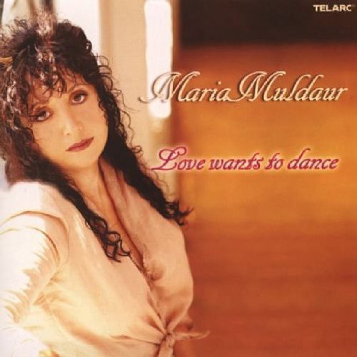 the album cover for Maria Muldaur - Love Wants to Dance