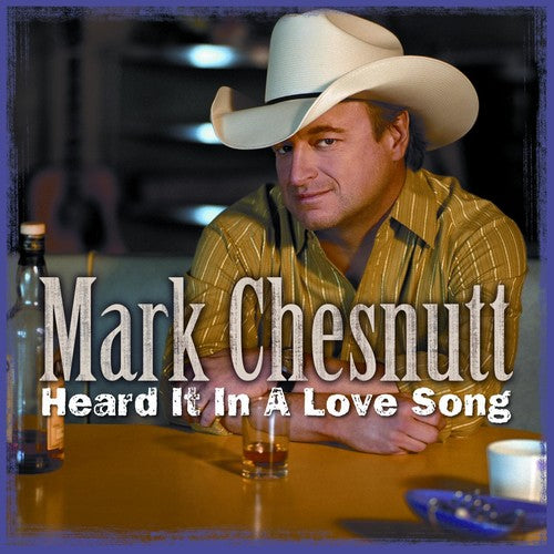 the album cover for Mark Chesnutt - Heard It In A Love Song