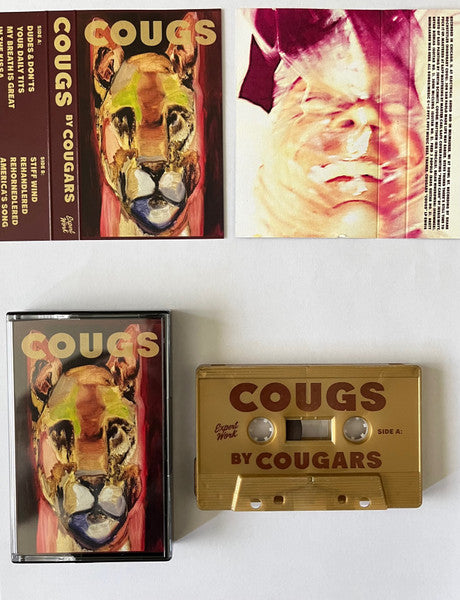 Cougars - COUGS. Gold Shell Color Cassette Tape
