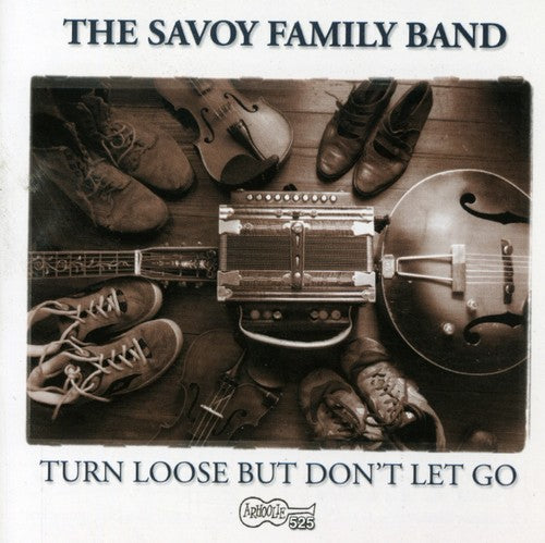 the album cover for Savoy Family Band - Turn Loose But Don't Let Go
