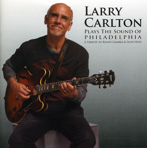 the album cover for Larry Carlton - Plays the Sound of Philadelphia