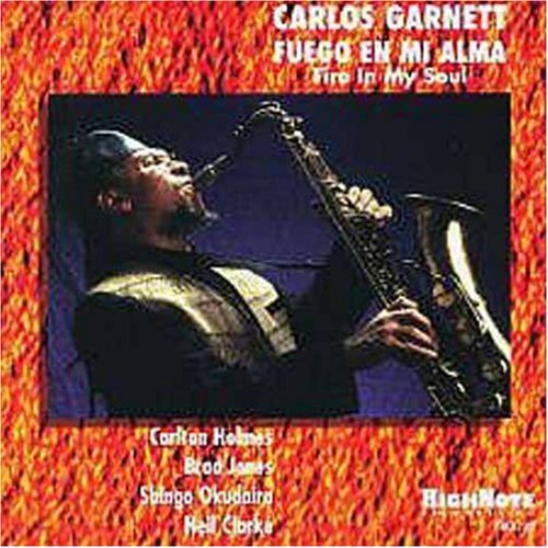 the album cover for Carlos Garnett - Fuego Mi Alma (Fire in My Soul)
