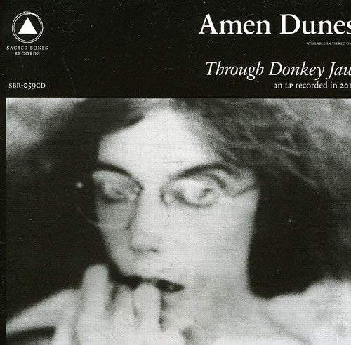 the album cover for Amen Dunes - Through Donkey Jaw