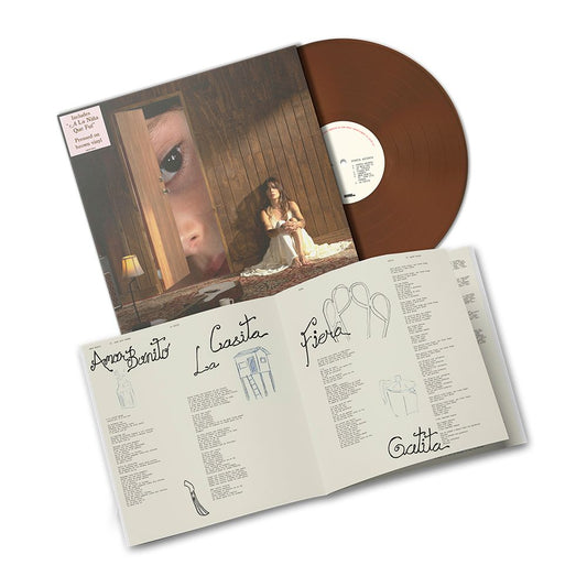 the album cover for Kany Garcia - Puerta Abierta [Brown]