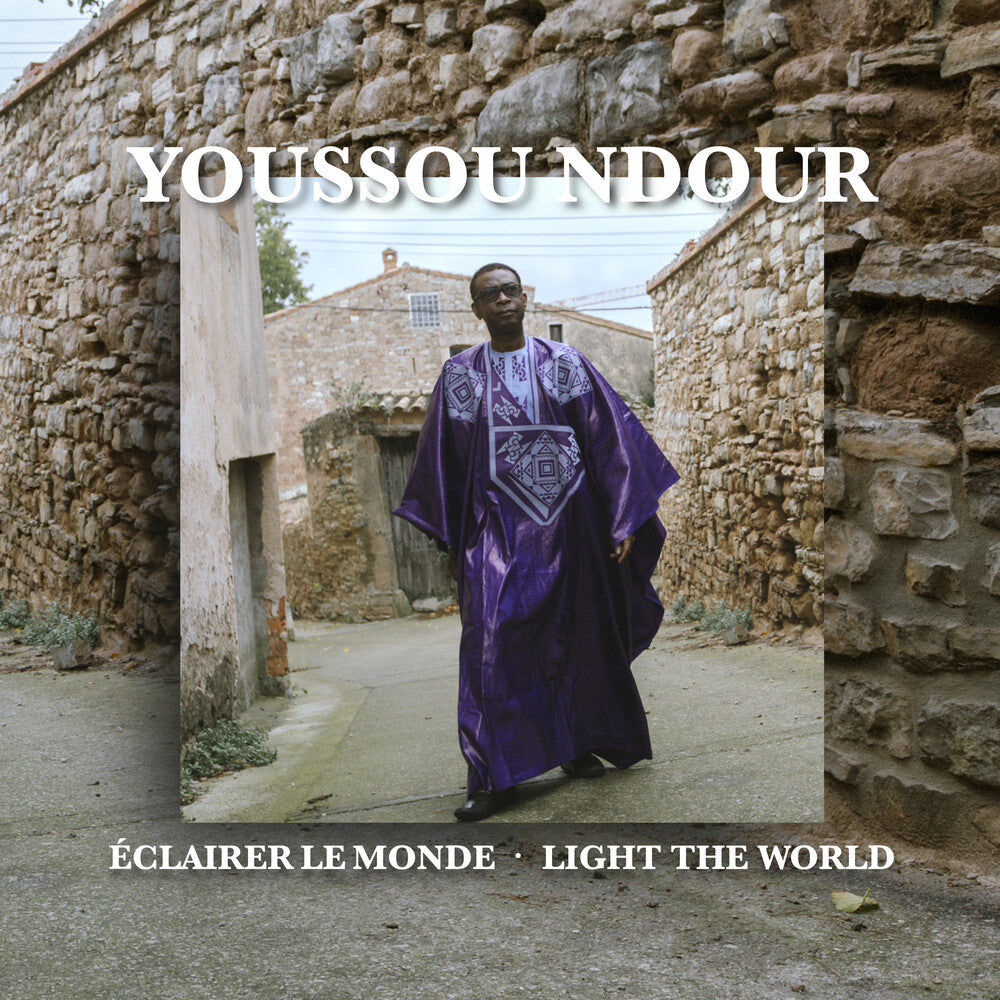 the album cover for Youssou N'Dour - Eclairer Le Monde / Light The World (Aus)
