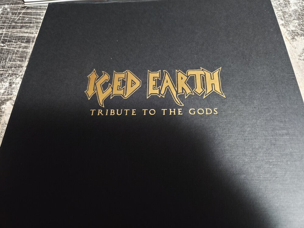 the album cover for Iced Earth - Tribute To The Gods [Colored Vinyl] [Deluxe] (Emb) (Gol) [Limited Edition]