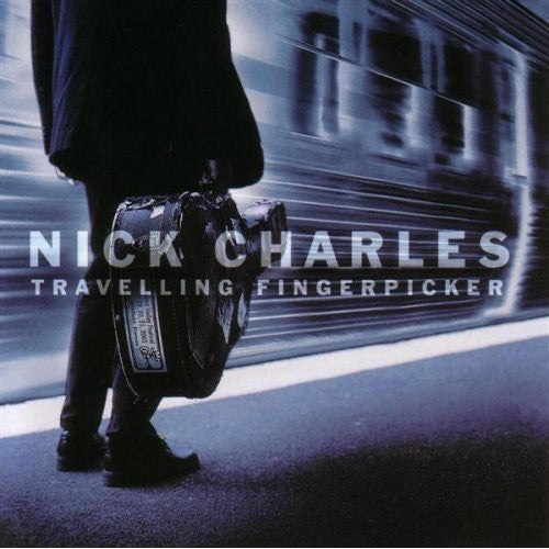 the album cover for Nick Charles - Travelling Fingerpicker